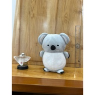 Koala Koala teddy bear carrying a leaf, wearing a leaf