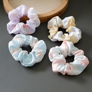 Cool rainbow-dyed knotted hair tie.