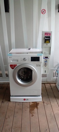 เครื่องซักผ้าฝาหน้า LG 9kgพร้อมกล่องหยอดเหรียญและแบงค์