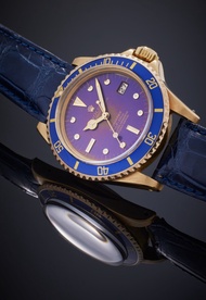 Rolex Reference 1680 Submariner | A yellow gold automatic wristwatch with date and tropical dial, Ci
