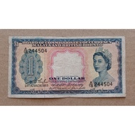 1 Dollar Malaya And British Borneo Queen Elizabeth.Condition Vf