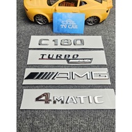 Braille letter C180 is pasted on the back of Mercedes-Benz C180