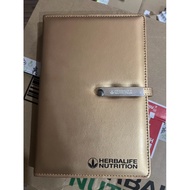 gold colour Herbalife notebook