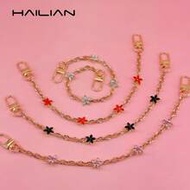 A Bag Strap Made Of Alloy Material With Four-Leaf Clover. The Four-Leaf Clover Is A Symbol Of Luck. 