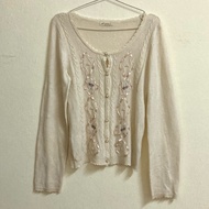 Cream Cardigan axes