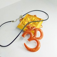 brown Hindu aum pendant with string