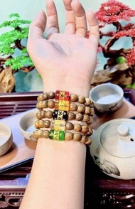 Vòng tay gỗ trầm hương mic lu thống tài lộc khắc chú Ommani
