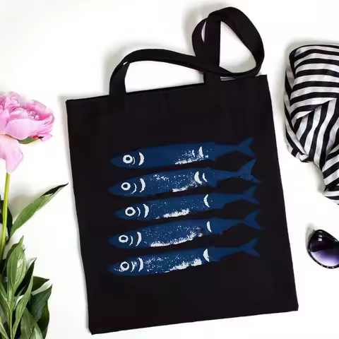 A canvas tote bag with a blue fish design，Reusable shopping bag with fashionable sardine print