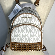 เป้ Michael Kors แท้ Coated canvas ลาย MK สายหนัง มีตำหนิที่หนังกุ๊นขอบและสายแตกลอกหลุดร่วง ลดราคาขาดทุน Clearance Michael Kors ABBEY XS EXTRA SMALL STUDDED BACKPACK 35T7GAYB0B VANILLA Clearance