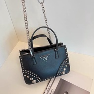 Prada • 限量黑銀卯釘十字紋牛皮 Mini殺手包