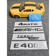 Braille letter E400 is pasted on the back of Mercedes-Benz E400