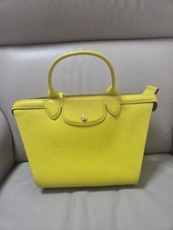 Longchamp 的 Le Pliage Héritage 系列皮手袋