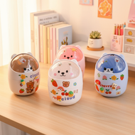 A mini trash bin with a flip-top lid and cute bear design, ideal for desk use.  Sebuah tong sampah m