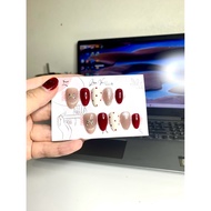 Nailbox from red custard apple seeds with polka dots mixed with cat's eye