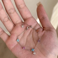 Charm bracelet with 4-leaf clover motif studded with multi-colored stones