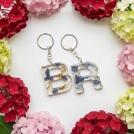 GANTUNGAN Dried Blue Flower Initial Letter Keychain in Transparent l Resin l Souvenir l Bag l Keycha