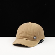 Korean version of the new classic solid color washed cotton personality letter embroidery short brim