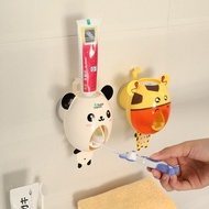 ท่อบีบยาสีฟันฟันแบบกดติดผนังอัตโนมัติรูปการ์ตูนน่ารักที่บีบยาสีฟันอุปกรณ์ในห้องน้ำสำหรับเด็กและเด็ก