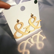 & symbolic metal earrings