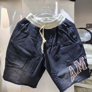 กางเกงขาสั้นทรงหลวมสำหรับผู้ชายและผู้หญิงปักลายตัวอักษรสไตล์อเมริกัน AMIRI ฤดูร้อนปี 2025 กางเกงขาสั