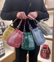 COACH Mini Dempsey Bucket Bag In Signature Jacquard With Stripe And Coach Patch