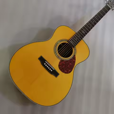 OM28JM acoustic guitar with built in soundhole pickups
