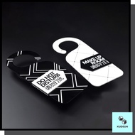 Do not disturb sign hanging on the door, do not disturb hotel room sign