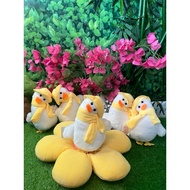 Duck wearing scarf stuffed animal toy