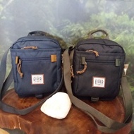 EIGER1989 Original Portege Vertical Pouch Sling Bag.