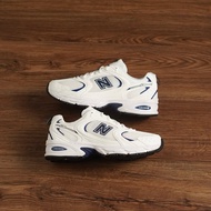 530 White Navy Sneakers