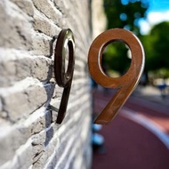 Red iron-grained house number, 4D mounted.