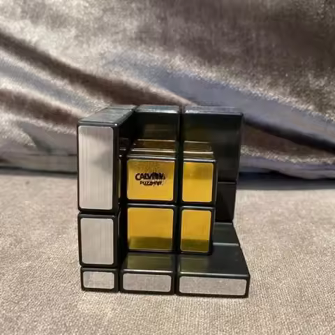 Calvin's Puzzle Cube 3x3 Gray Mirror Illusion Inside (Black Body, Silver-Gold Label) in Small Clear 