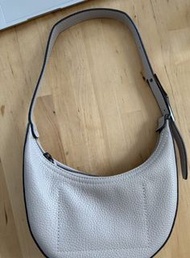 Longchamp Roseau Essential hobo bag in a neutral color with a textured leather finish
