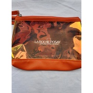 Convenient orange La roche posssay cosmetic bag