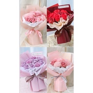 Bouquet of 7 scented wax roses with bag, greeting tag hanging on Hy Hy Store bag