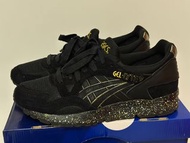 Asics Gel-Lyte V sneaker in a black with gold accents US 9.5