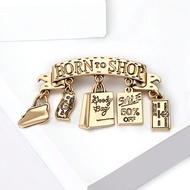 เข็มกลัด "Born To Shop" - เข็มกลัดป้ายสัญลักษณ์การช้อปปิ้งที่สนุกสนานพร้อมลวดลายดอกเงิน สำหรับคนรักแ