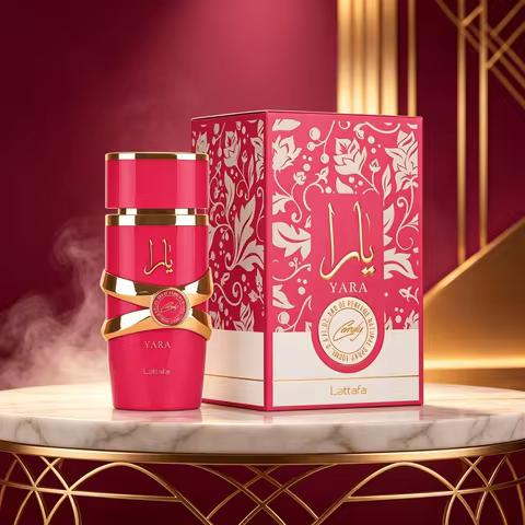 Lattafa Yara Candy EDP Is a Neutral Perfume in 100ml. It Features a Bright Pinkish-Red Bottle with G