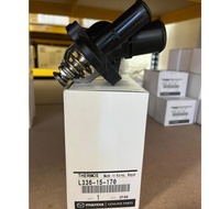 100% GENUINE (MAZDA) THERMOSTAT WITH HOUSING MAZDA 3/6/8/MAZDA CX7>>L336 15 170