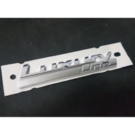 BMW 320 I LUXURY LINE LOGO Attached To The Side Of The Car
