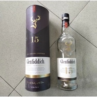 Empty used glass bottle The Glenfiddich 15 1000 ML