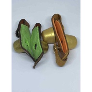 Durable leather leg weights for chickens.