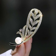 Brooch with branches and leaves studded with stones