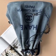 ::CHANEL:: 香奈兒Deauville 藍色丹寧布亮片字母裝飾抽繩後背包