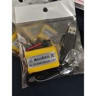 Yellow Ni-Cd AAA 700mAh 3.6V rechargeable battery pack with USB charging cable and connector.