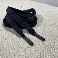 Black flat plastic aglet capsule style pants