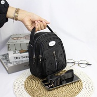 4 compartment sling bag / can be carried as a backpack / 3 in 1 bag