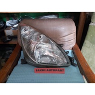 Original right grand livina headlamp