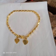 18/375 gold rice motif young gold adult bracelet weighing 4 grams