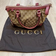 Gucci 粉紫水餃包